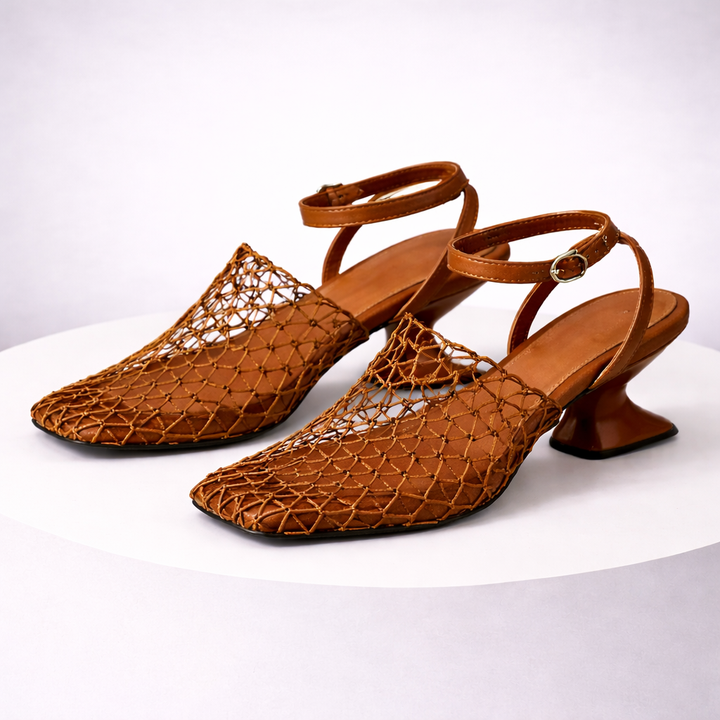 Black women's sculpted heel strappy sandals. Elegant dress shoes with a sleek pointed toe design.