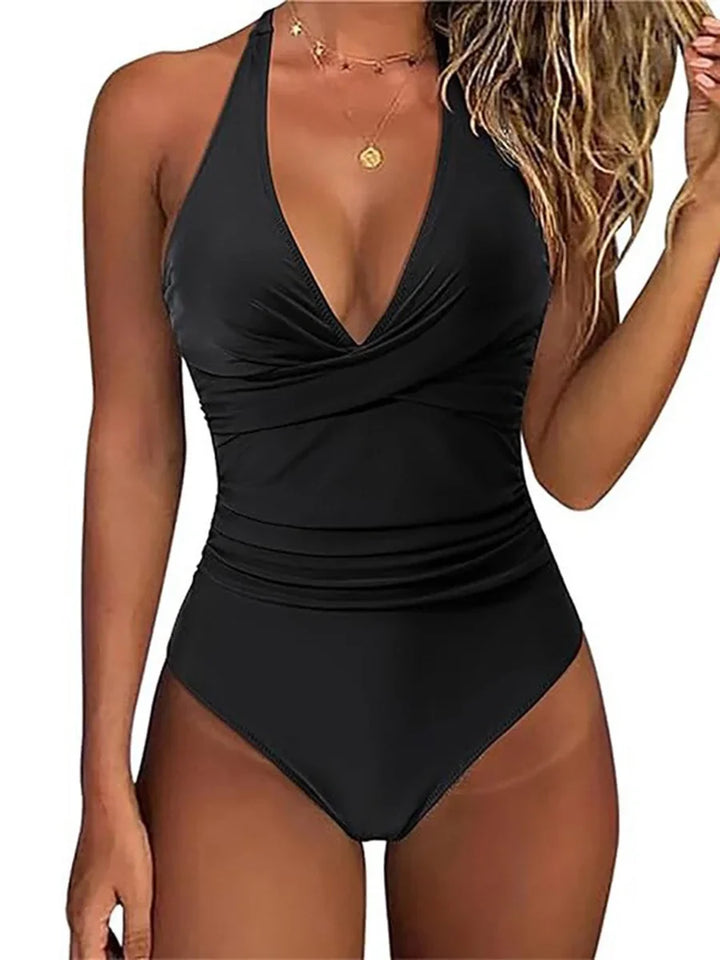 Vibrant women's sculpting halter neck swimsuit, perfect beachwear for a stylish & flattering vacation.