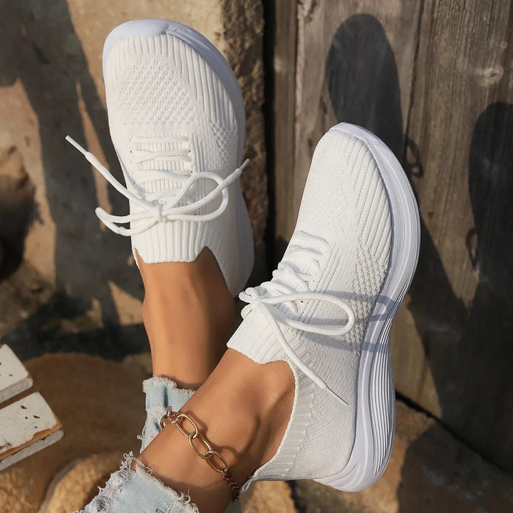 Versatile women's lace-up sneakers, minimalist design for casual & athleisure street style.