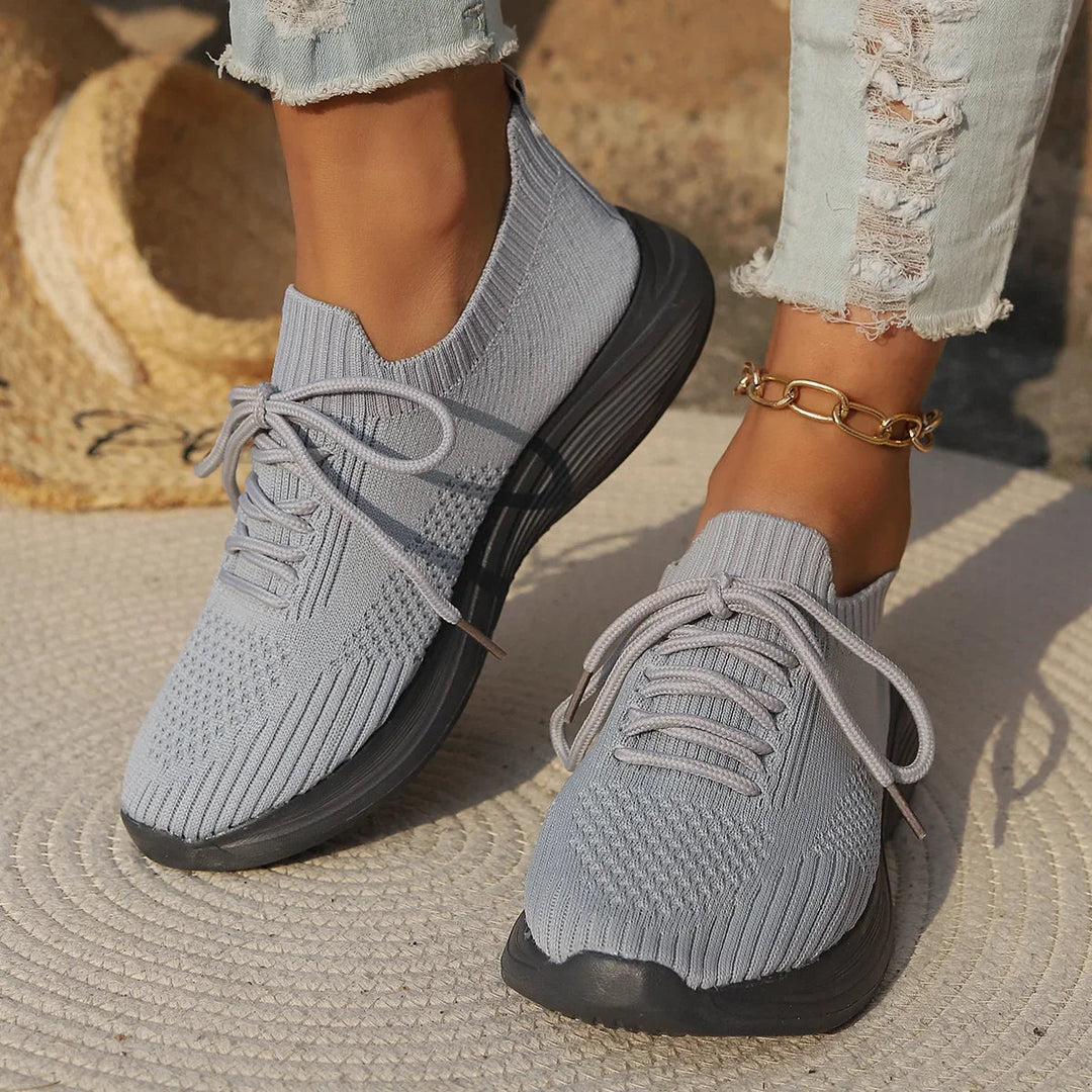 Lightweight seamless women's sneakers with lace-up closure for comfortable, flexible everyday wear.