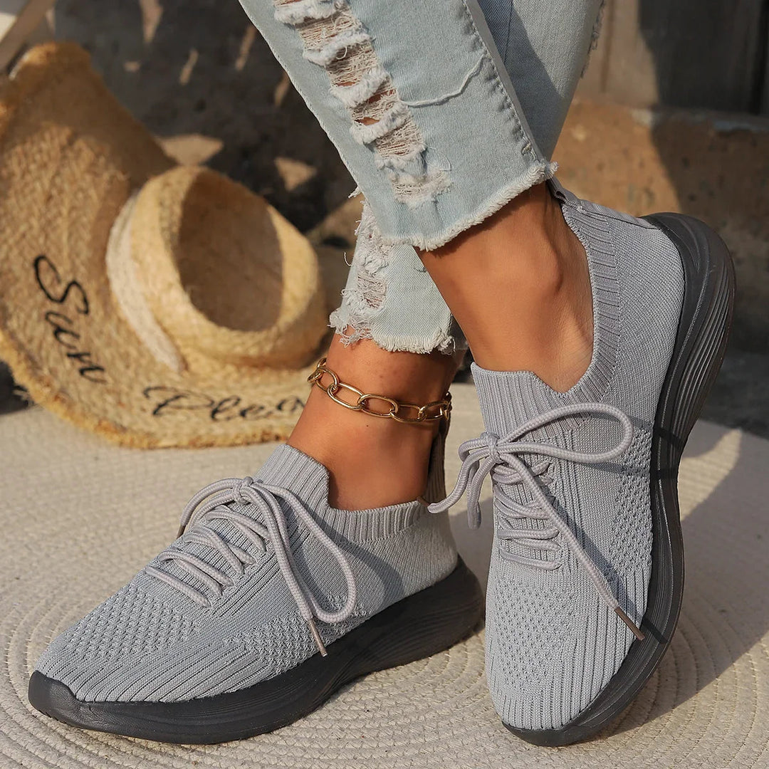 Women's everyday walking sneakers, lightweight seamless design with secure lace-up fit for comfort.