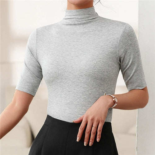 Comfortable women's seamless slim fit long-sleeve turtleneck top, offering a sleek and smooth silhouette.