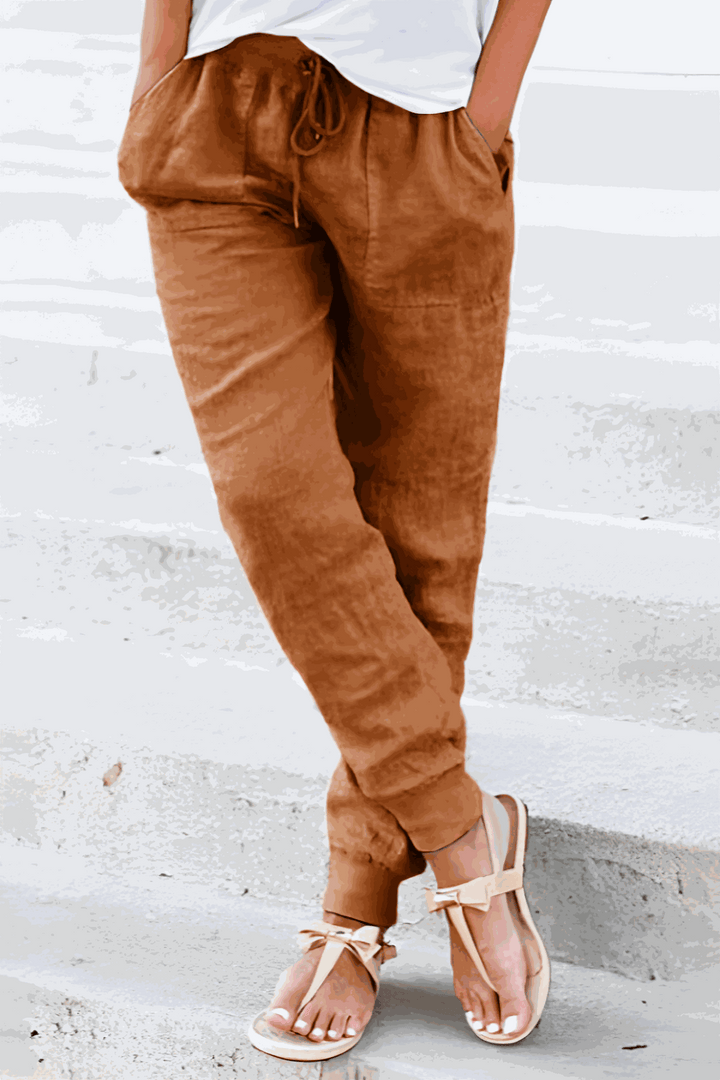 Woman relaxing in Sedona casual joggers, highlighting their comfort for loungewear and everyday activities.