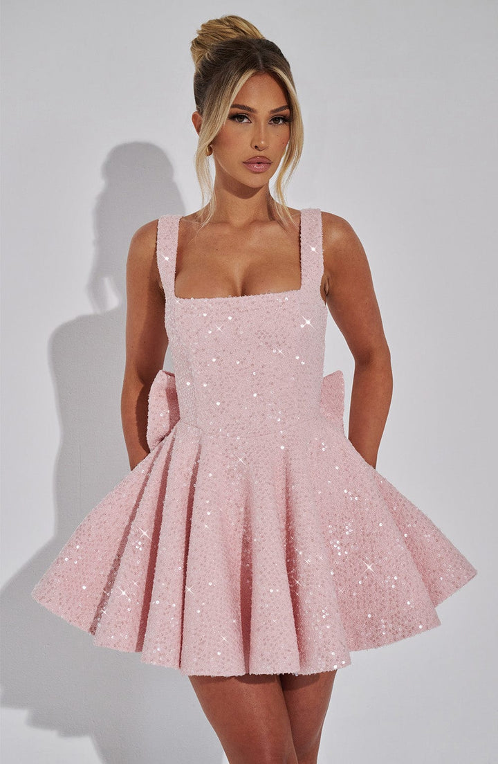 Women's sequin fit & flare mini dress with back bow detail, ideal for parties.