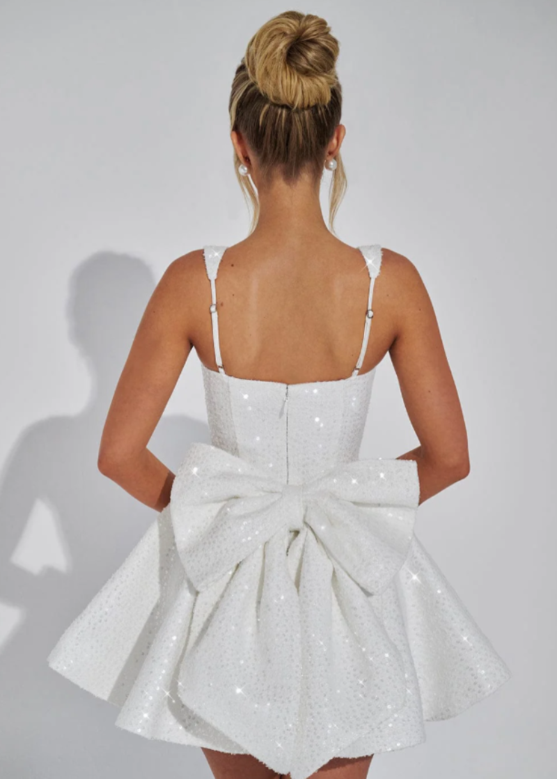 Sparkling women's fit & flare sequin mini dress, perfect for cocktails and special occasions, with a stylish back bow.