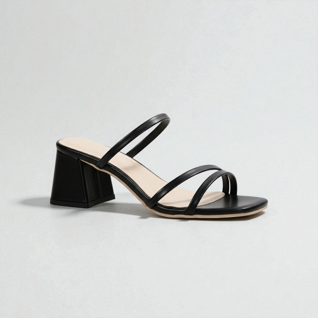 Comfortable women's slip-on sandals with a chunky block heel, perfect for minimalist summer fashion.