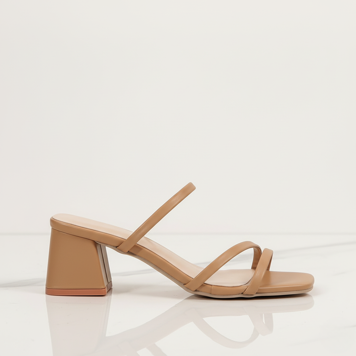 Elegant women's fashion sandals featuring a serene minimalist square toe and sturdy block heel.