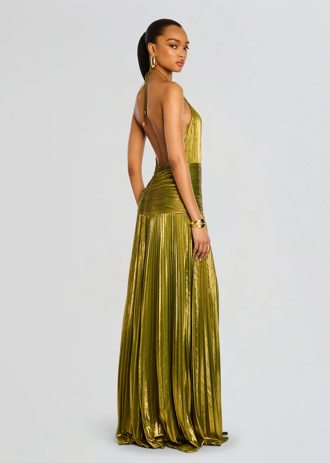 Elegant women's halter maxi dress with glittering fabric, ideal for special occasions & formal events.