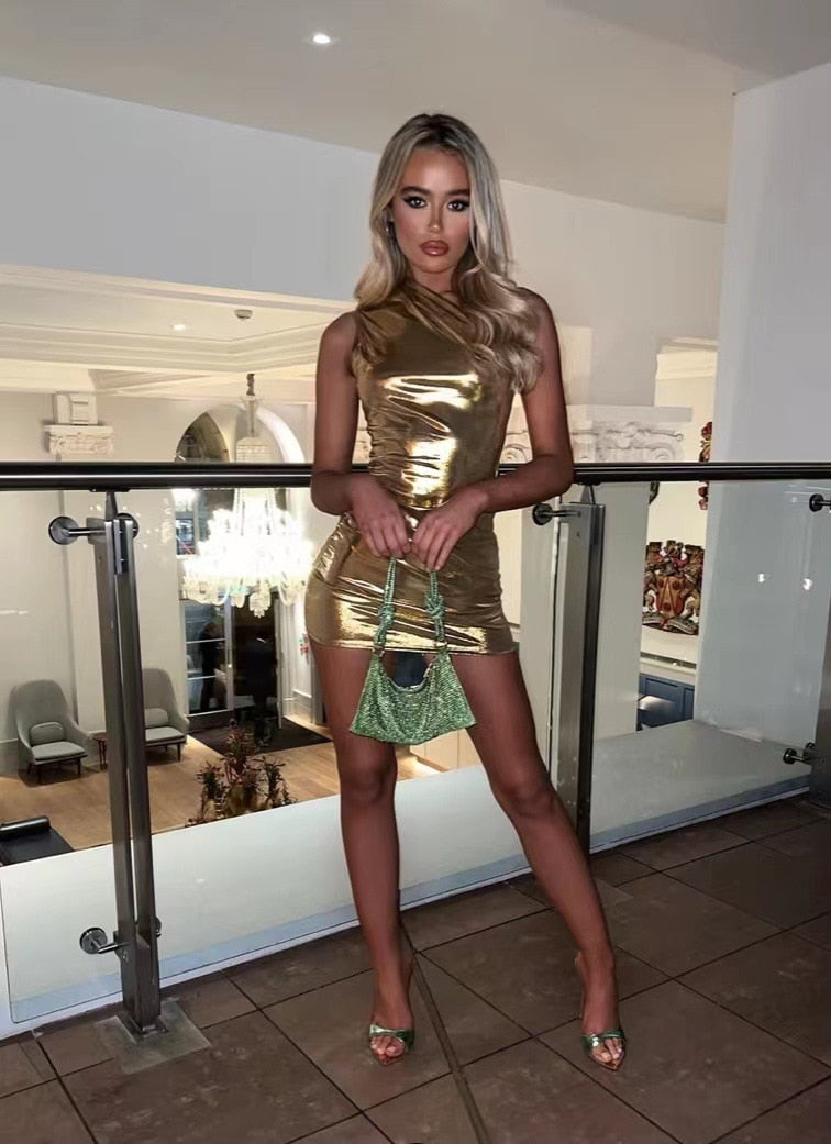 Stylish women's metallic mini dress, shimmering fabric, ideal for cocktails & glamorous parties.