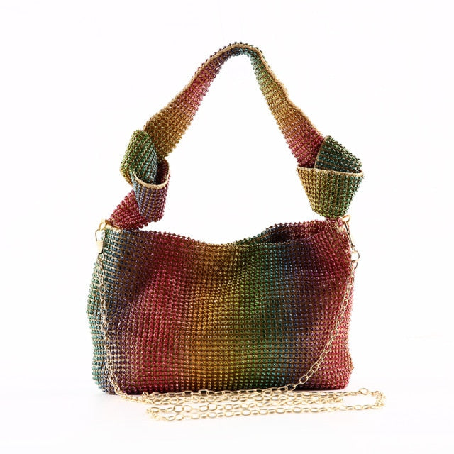 Close-up of a women's rhinestone evening clutch with dazzling shimmer. A stylish metallic accessory for any formal party.