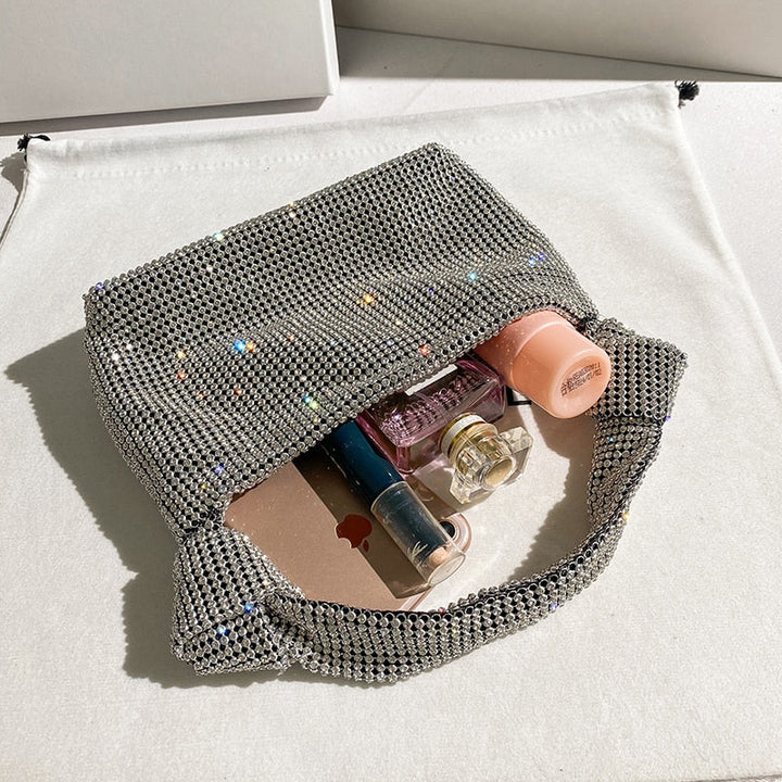 Women's sparkling rhinestone evening bag. Metallic clutch accessory for formal events, parties & special occasions.