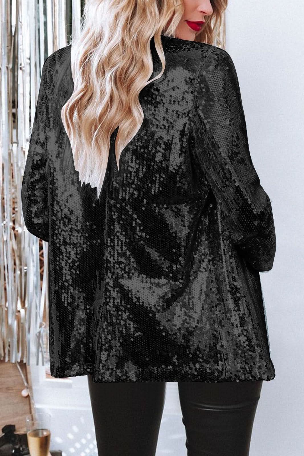 Stylish women's sequin blazer, shimmering with sequins, ideal for a glamorous party outfit.