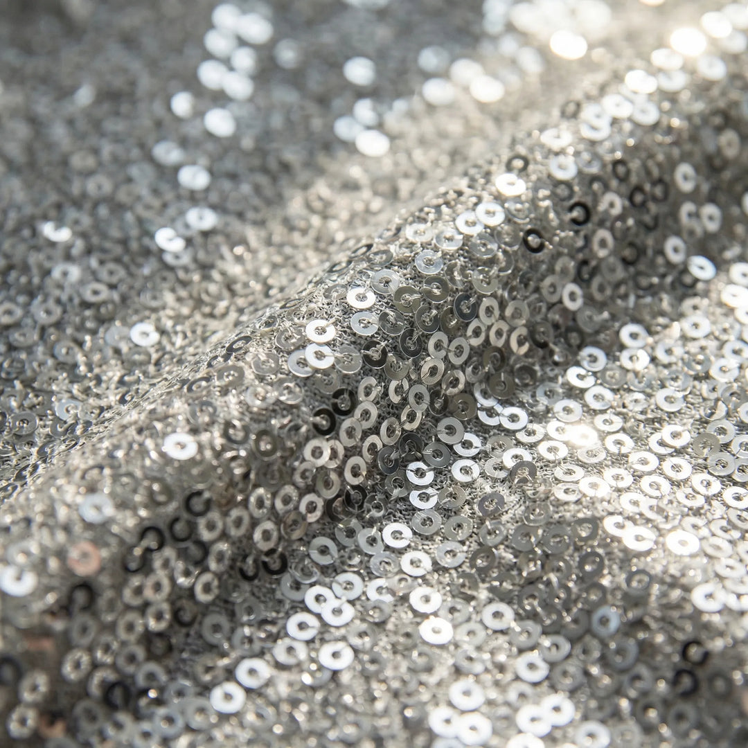 Radiant women's shimmery V-neck blouse with long sleeves, offering effortless elegance and fashion style.