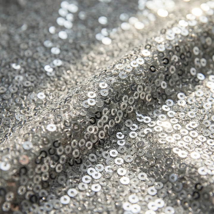 Radiant women's shimmery V-neck blouse with long sleeves, offering effortless elegance and fashion style.