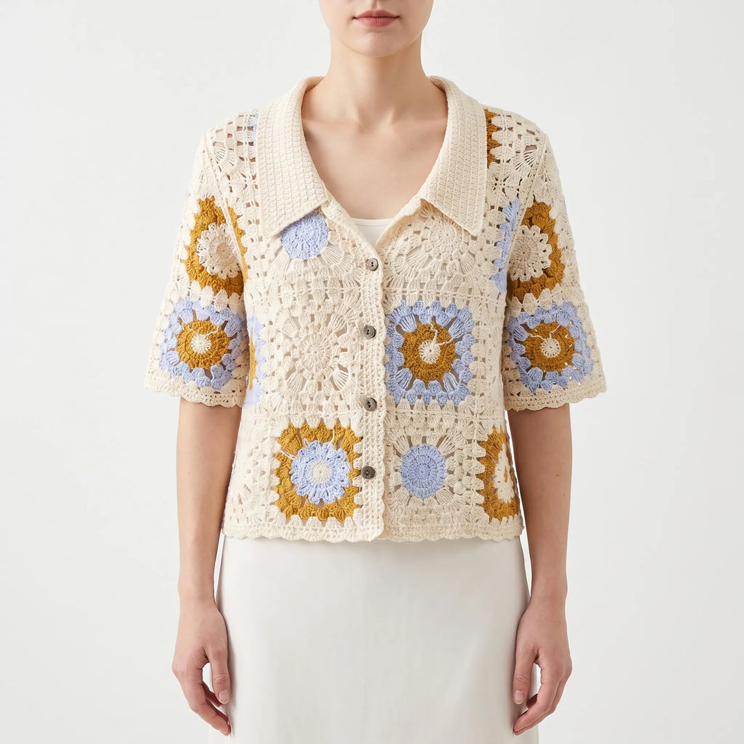 Lightweight women's short-sleeve crochet cardigan. Breathable open-knit top for comfortable summer fashion.