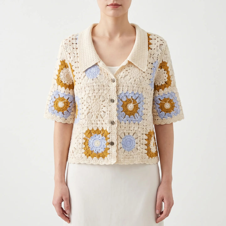 Lightweight women's short-sleeve crochet cardigan. Breathable open-knit top for comfortable summer fashion.