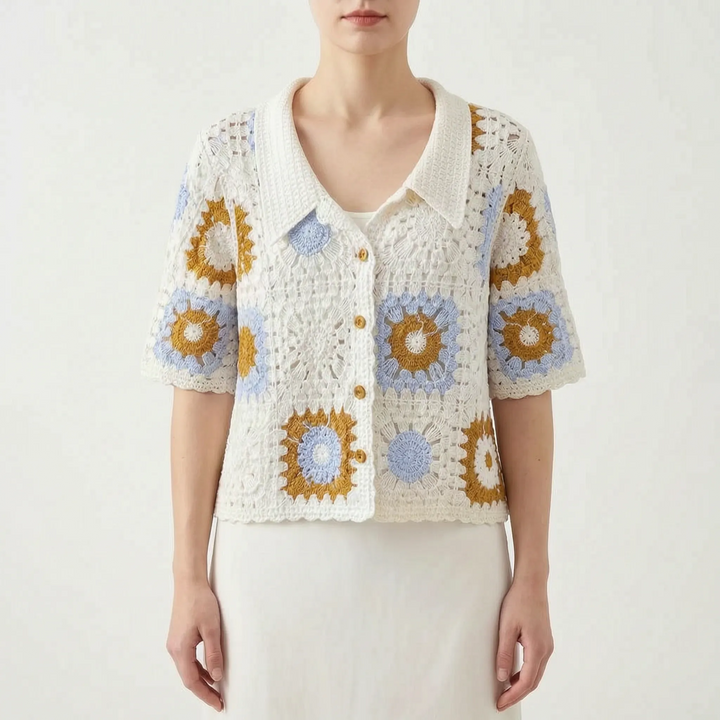 Women's short-sleeve crochet cardigan featuring a delicate geometric open-knit pattern. Chic summer layering top.