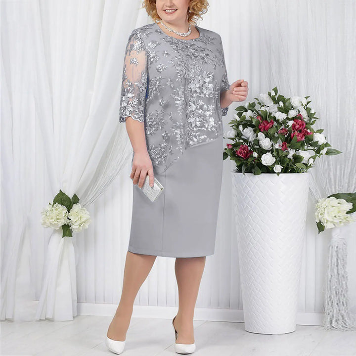Elegant women's short sleeve midi dress with delicate lace detail, perfect for cocktail or party wear.