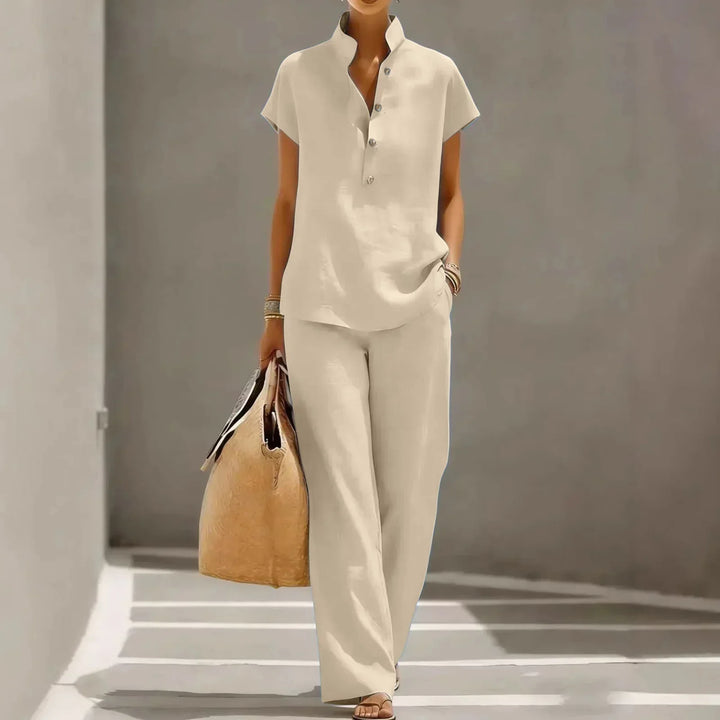 Matching women's two-piece short sleeve lounge set with wide-leg pants, versatile for resort wear & casual summer.