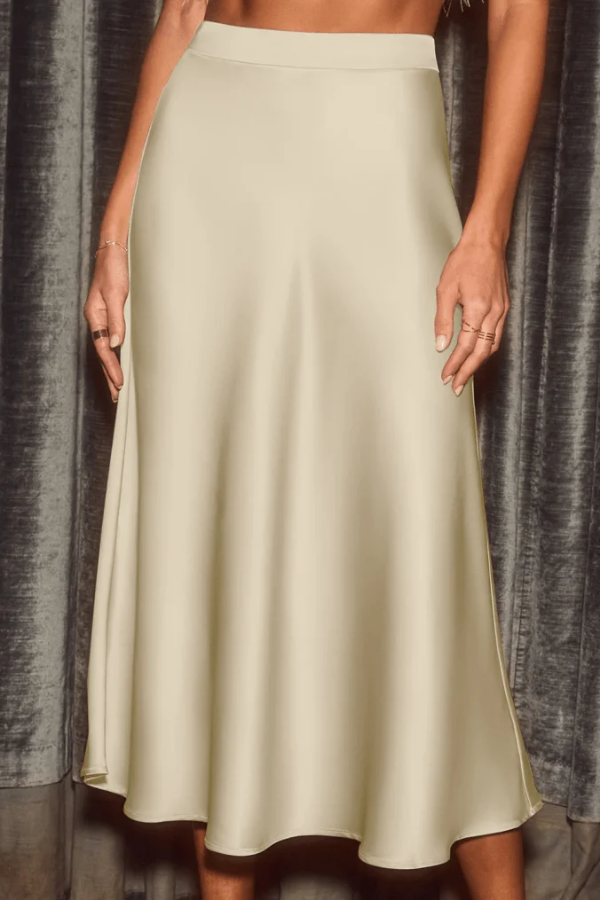 Versatile women's sleek flow midi skirt. Elegant A-line for formal wear or casual chic. High-rise long skirt.