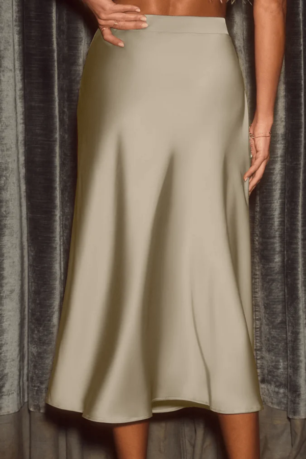 Casual chic women's sleek flow midi skirt. High-rise A-line design, elegant and versatile for modern fashion.