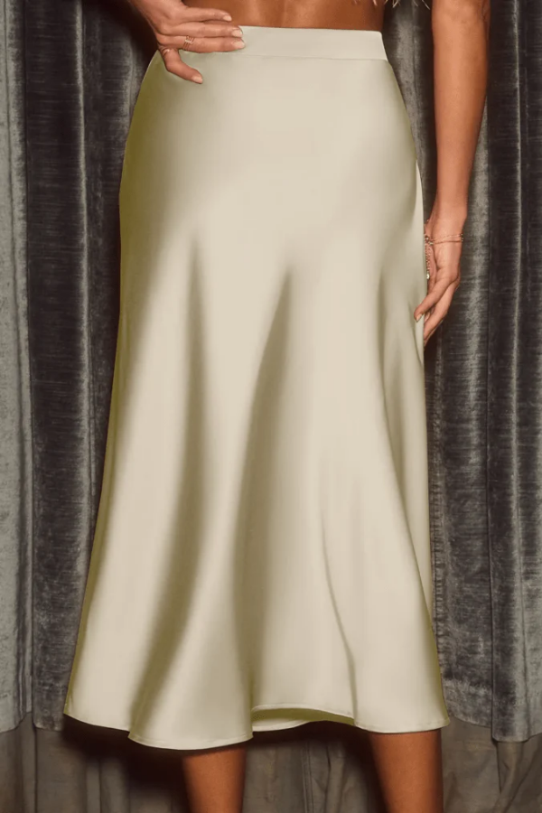 Women's high-rise A-line midi skirt, sleek and flowy for elegant versatile style. Perfect long skirt for any occasion.