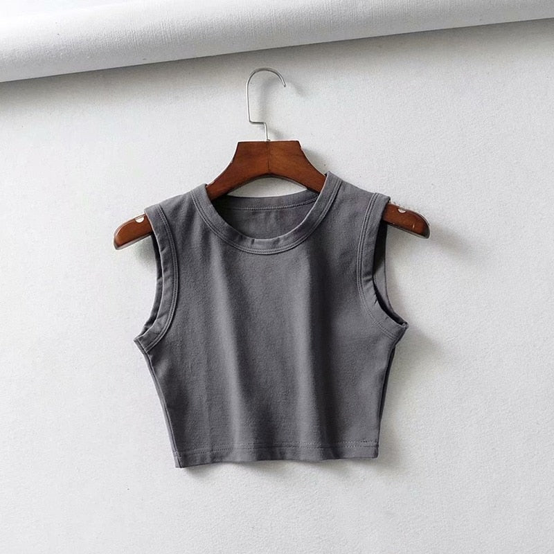 Fitted women's crop top, sleeveless design. Lightweight & perfect for active summer casual wear.