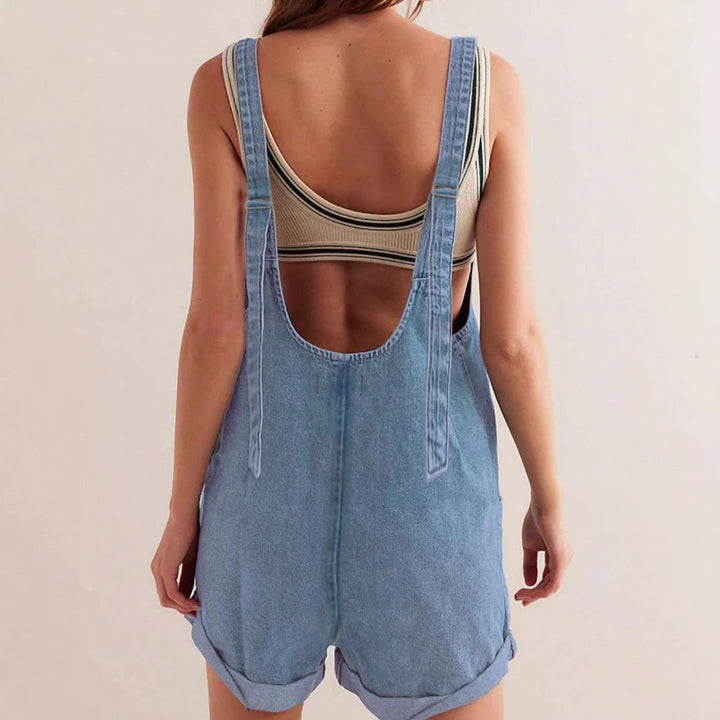Dark blue women's sleeveless denim romper, a casual and comfortable one-piece with practical pockets for summer.