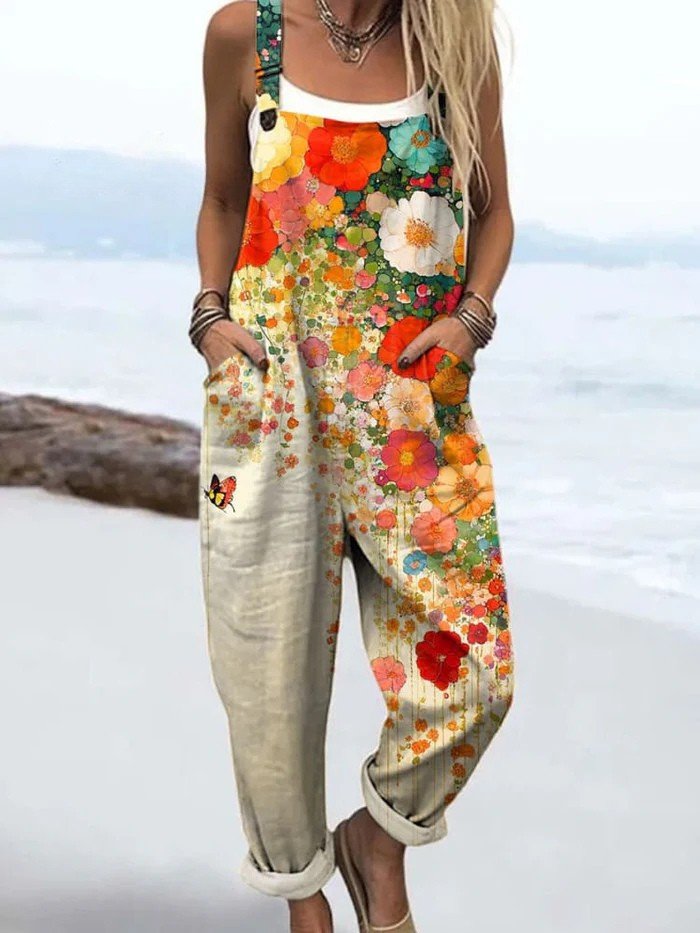 Women's sleeveless floral wide leg jumpsuit with vibrant print, perfect for summer comfort and casual elegance, includes pockets.
