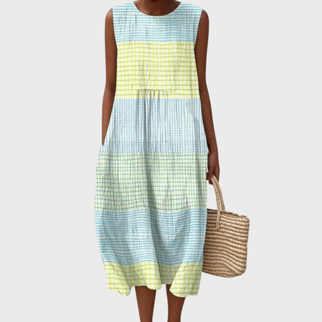 Women's sleeveless patchwork midi dress with a relaxed bubble hem and artistic pattern, perfect for summer casual wear.