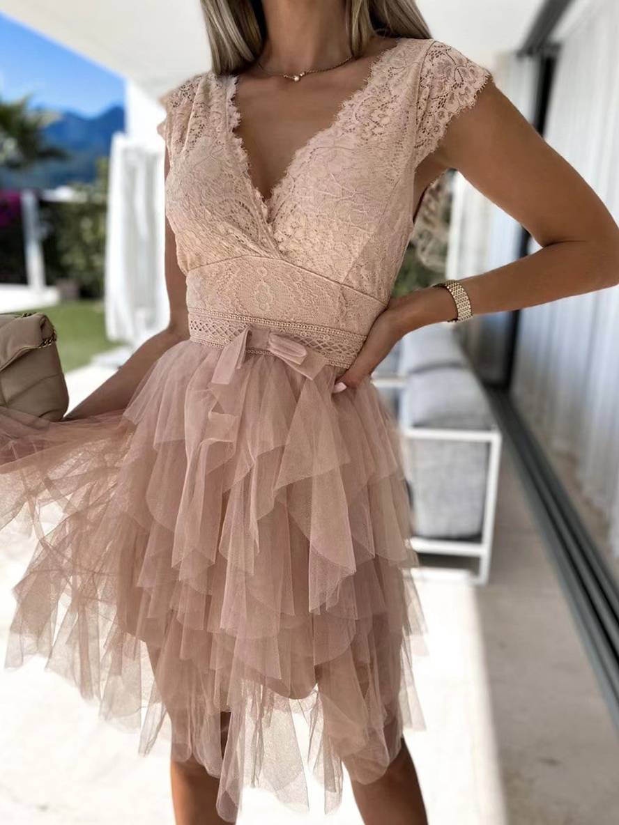 White sleeveless V-neck tutu party dress. Chic women's formal wear, great for special occasion celebrations.