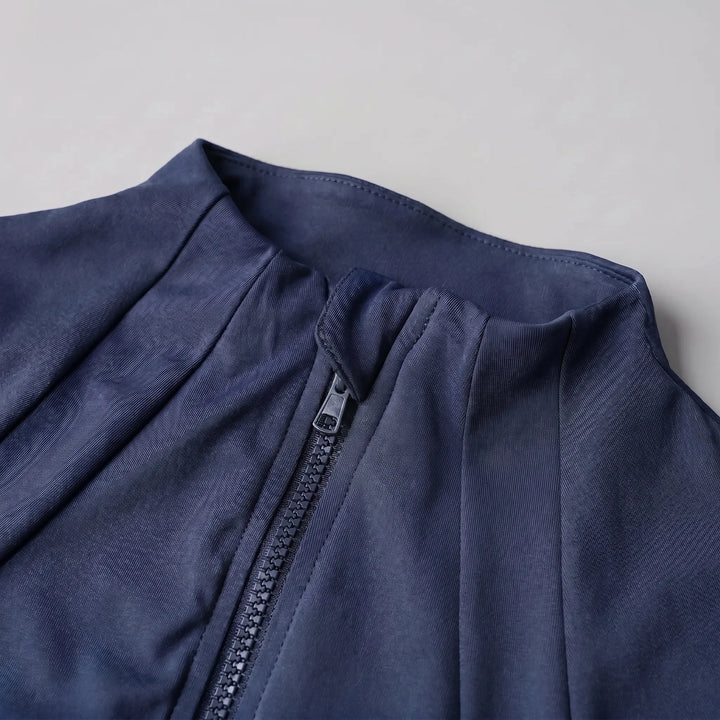 Stylish women's activewear jacket, slim-fit design for gym, yoga, or everyday fitness apparel.
