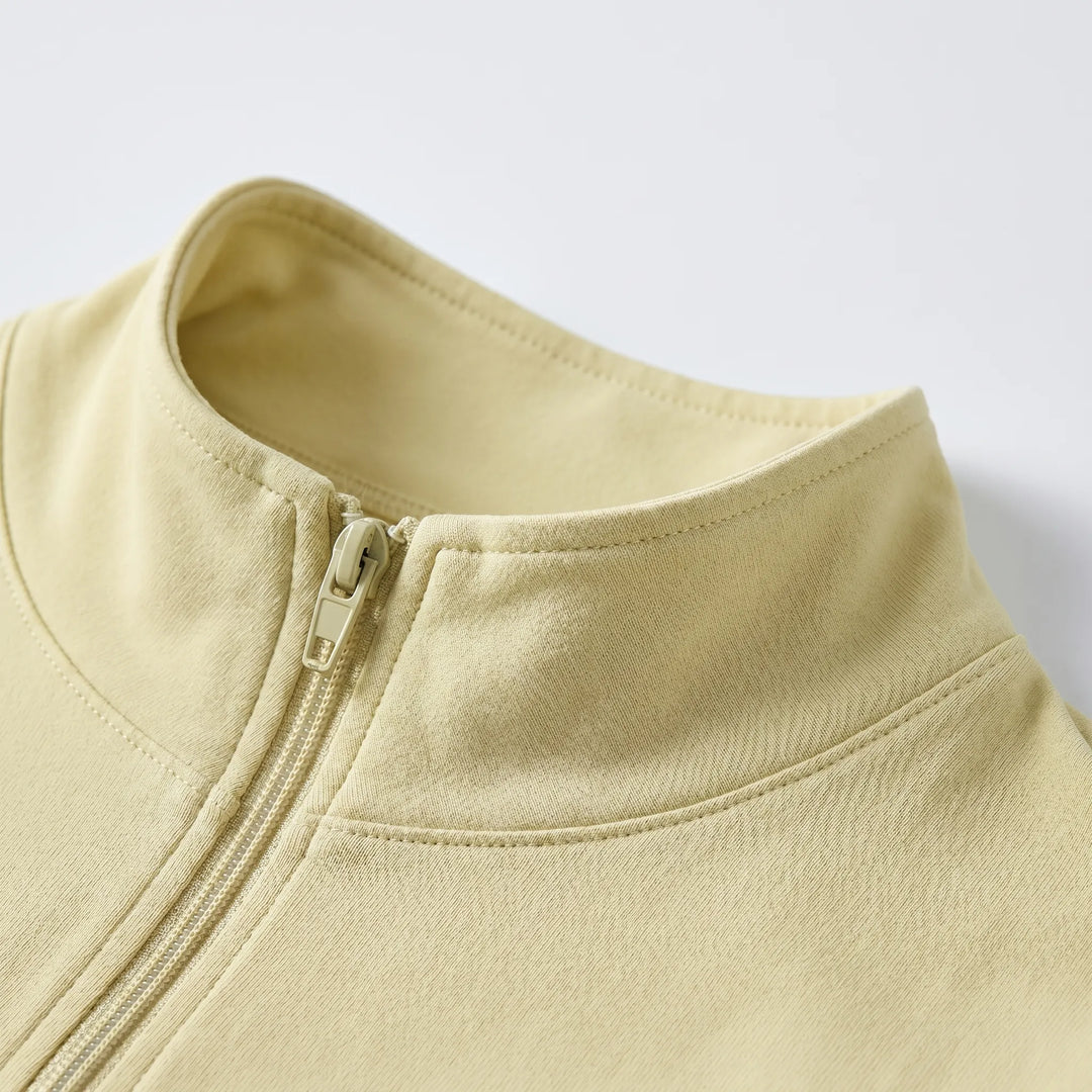 Stylish slim-fit athletic jacket for women with long sleeves & moisture-wicking fabric.
