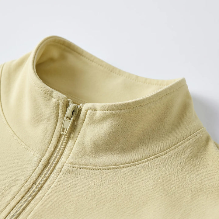 Stylish slim-fit athletic jacket for women with long sleeves & moisture-wicking fabric.