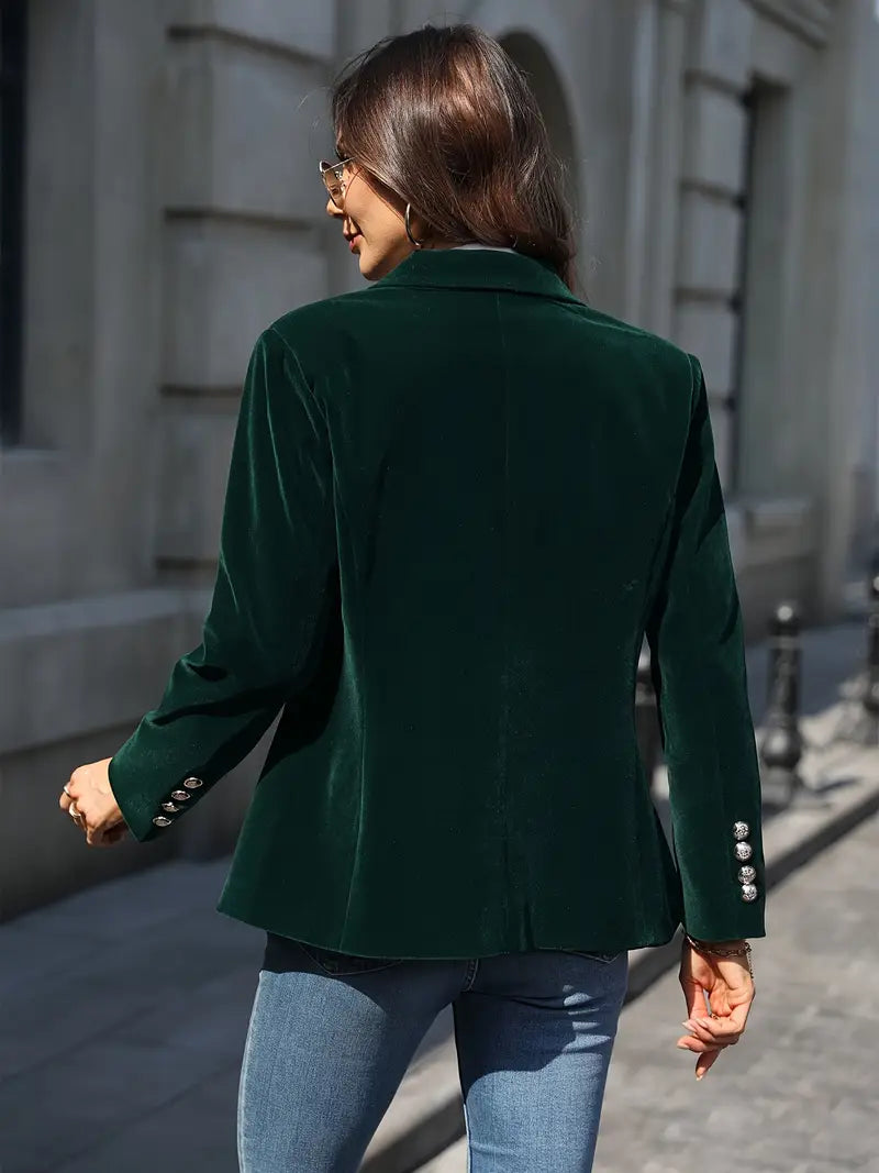 Elegant women's slim-fit blazer with a peak lapel and decorative gold buttons.