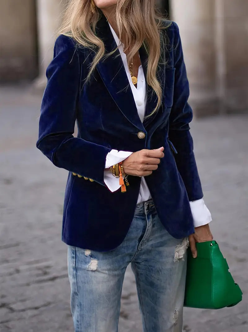 Elegant women's slim-fit blazer featuring a peak lapel and shimmering gold buttons.