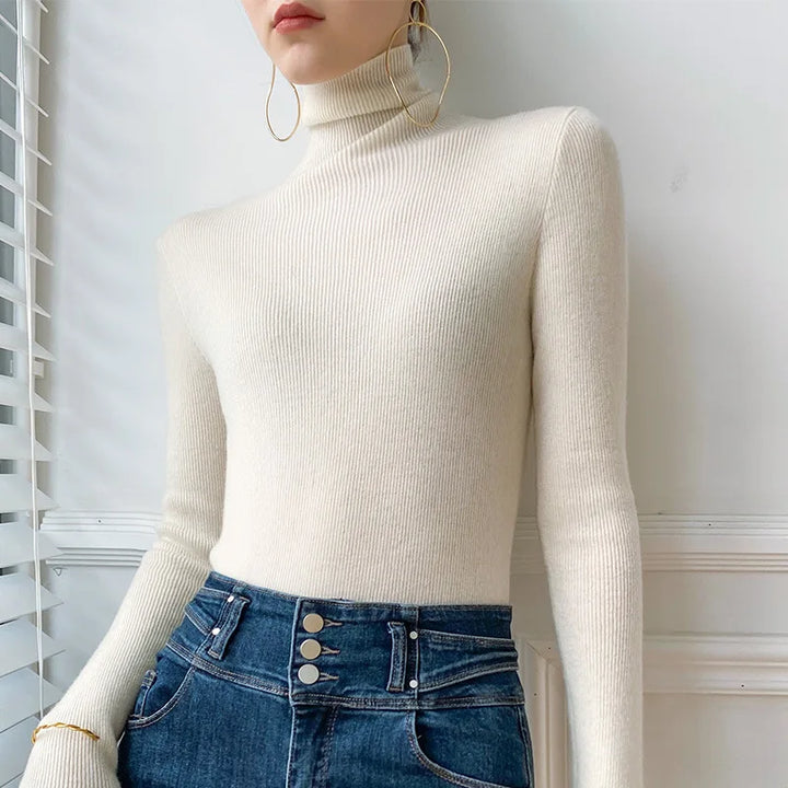 Stylish women's slim fit turtleneck sweater, a flattering long-sleeve design for modern fall and winter layering.