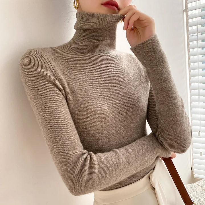 Comfortable women's slim fit turtleneck sweater with soft knit fabric, ideal for cozy everyday wear & layering.