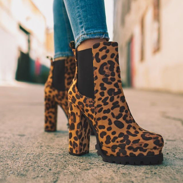 Stylish wine red platform ankle boots for women. Slip-on design with block heel for chic casual or evening wear.