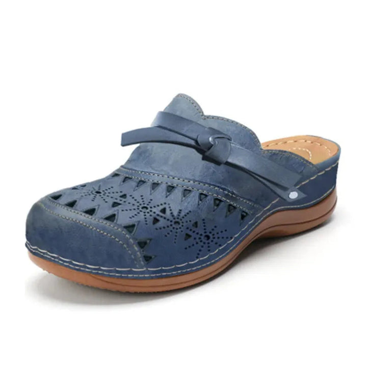 Women's slip-on clogs with a cute bow accent & cutout design. Perfect for casual summer comfort & everyday wear.