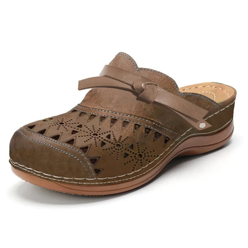 Full image of women's fashion clogs featuring a charming bow accent and unique cutout pattern, great for summer.