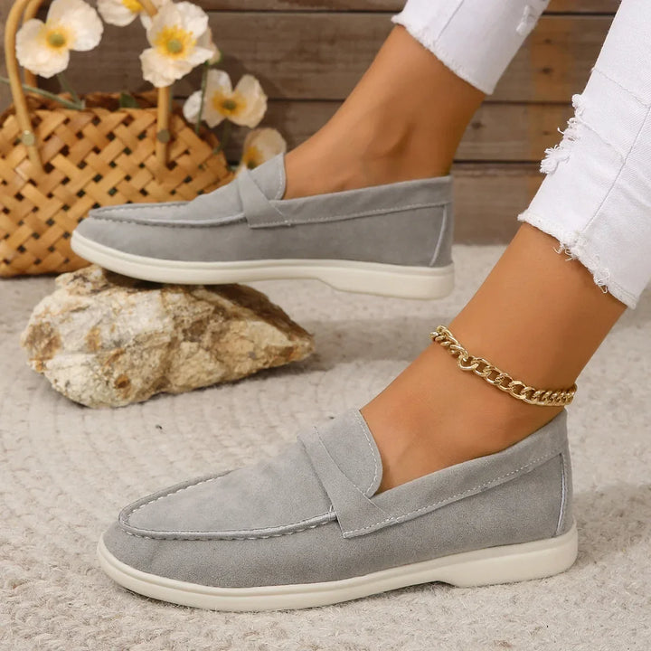 Women's slip-on loafers, black, cushioned for office and casual comfort.