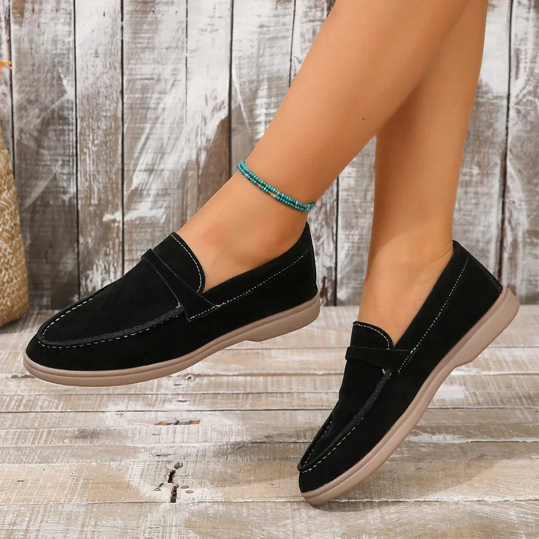 Top view: Women's black slip-on loafers, cushioned interior for comfortable office & casual wear.