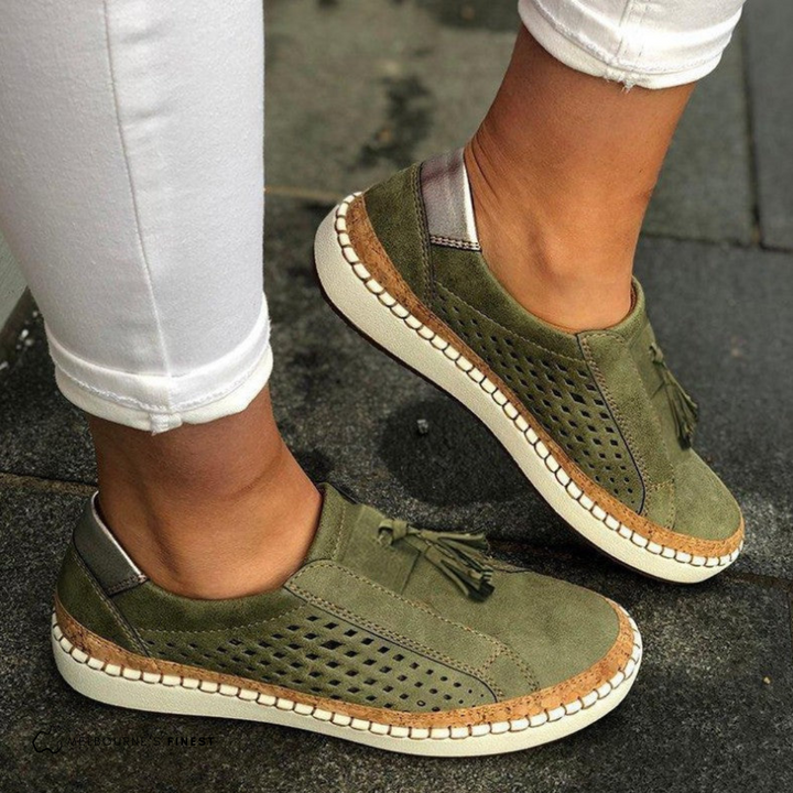 Stylish women's perforated tassel loafer flats, ideal for summer. Easy slip-on design offers versatile comfort.