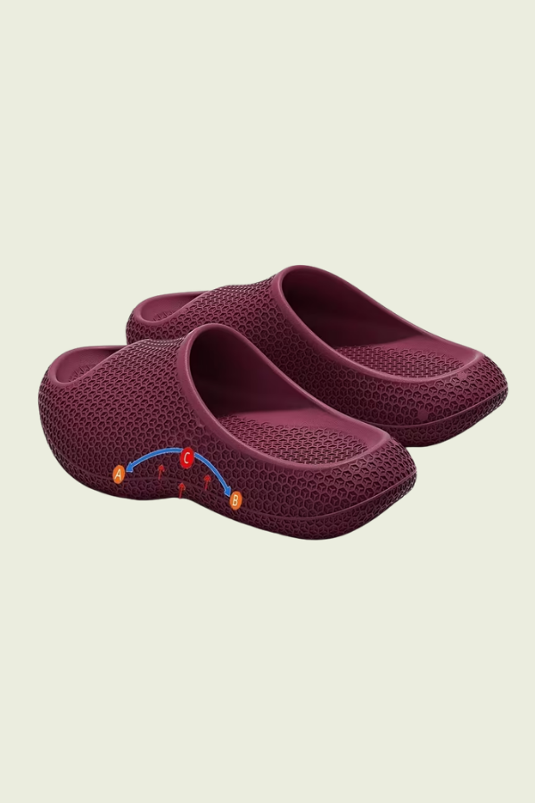 Cushioned women's slip-on slippers with arch support for ultimate indoor comfort & relaxation.