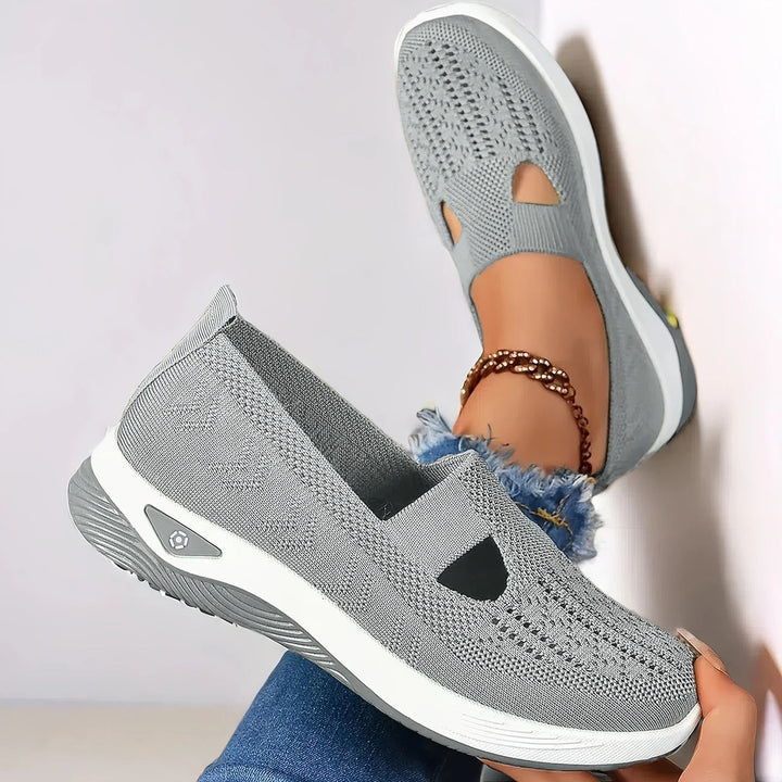 Comfortable women's slip-on walking shoes with strong arch support for everyday wear.