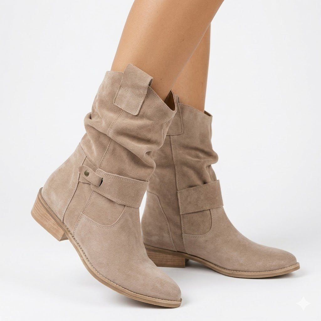 Women's slouchy ankle boots with a comfortable low heel and stylish buckle strap, perfect for fall.
