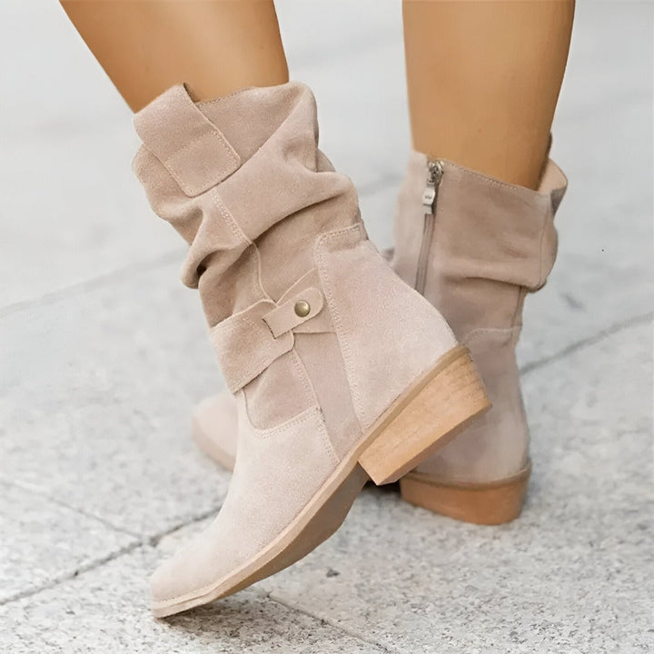 Chic women's slouchy ankle boots, low heel, buckle detail. Versatile and comfortable everyday fall footwear.
