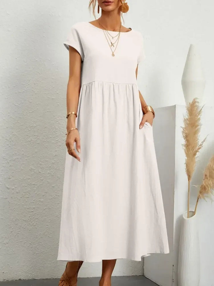 Flowy casual maxi dress for women with a comfortable smock waist and stylish short sleeves.