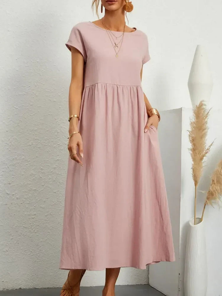 Summer-ready women's smock waist maxi dress with short sleeves, designed for casual style and comfort.